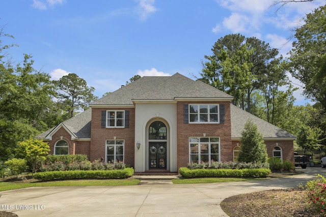 340 Sherborne Pl, Flowood, MS 39232 - traditional-style house featuring brick siding and a shingled roof