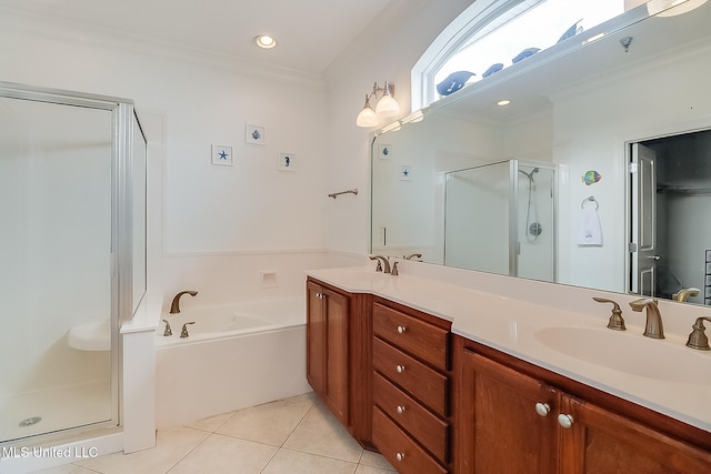 full bath featuring a shower stall, double vanity, ornamental molding, tile patterned floors, and a sink