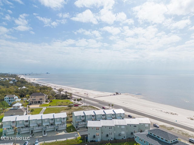 drone / aerial view featuring a view of the beach and a water view