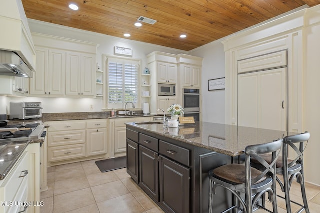 kitchen with visible vents, open shelves, a sink, wooden ceiling, and stainless steel appliances