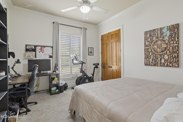 carpeted bedroom featuring crown molding and ceiling fan