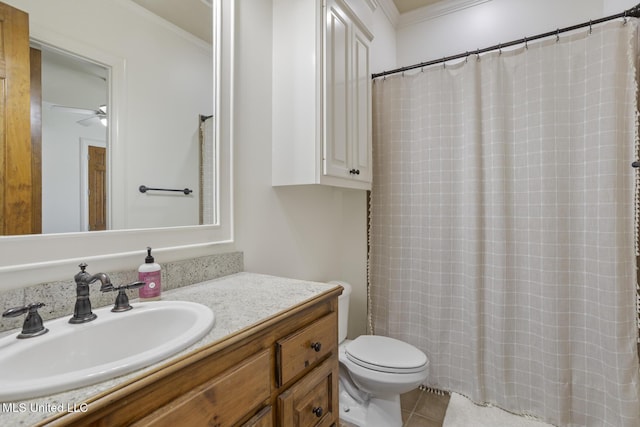 bathroom with vanity, crown molding, toilet, tile patterned floors, and a shower with curtain