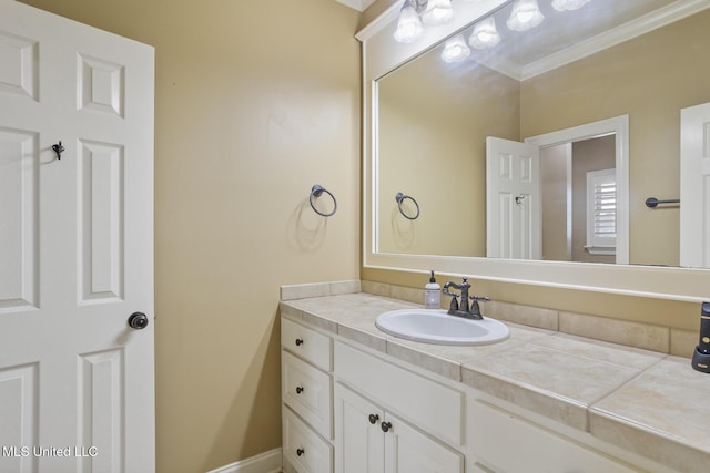 bathroom featuring vanity and ornamental molding