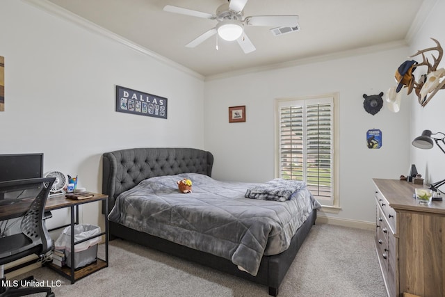 bedroom with visible vents, crown molding, carpet floors, baseboards, and ceiling fan
