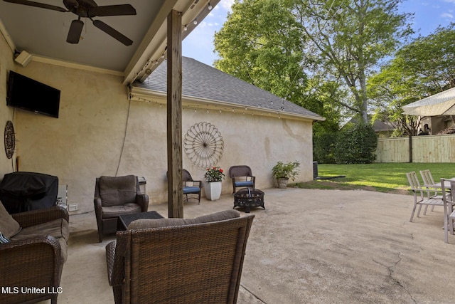view of patio with fence, an outdoor hangout area, and ceiling fan