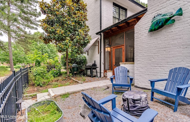107 Chadwyck Ct, Madison, MS 39110 - view of patio with grilling area, a sunroom, and a fenced backyard
