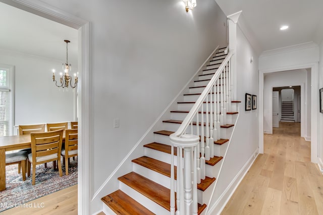 107 Chadwyck Ct, Madison, MS 39110 - staircase featuring wood finished floors, ornamental molding, a chandelier, baseboards, and recessed lighting
