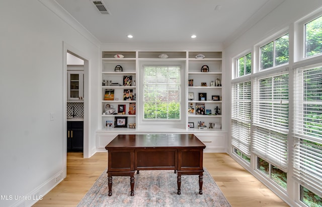 107 Chadwyck Ct, Madison, MS 39110 - office area with crown molding, light wood finished floors, recessed lighting, and built in features