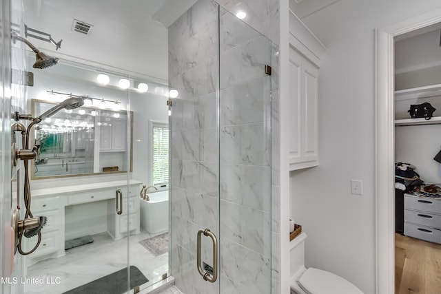 107 Chadwyck Ct, Madison, MS 39110 - full bath featuring a shower stall, a freestanding tub, and toilet