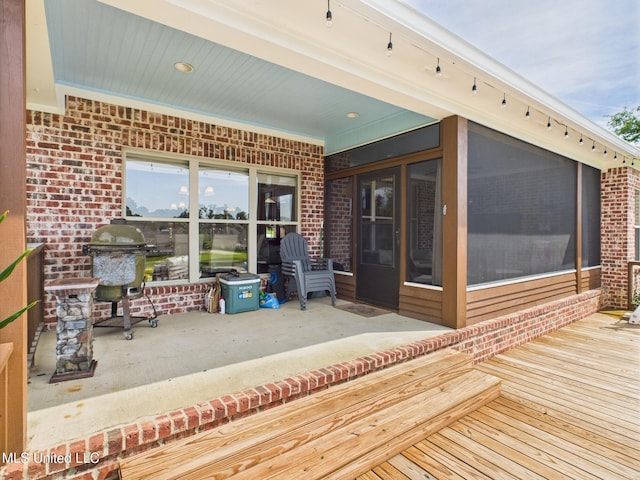143 Charlton Dr, Madison, MS 39110 - wooden deck with a patio area, a sunroom, and a grill