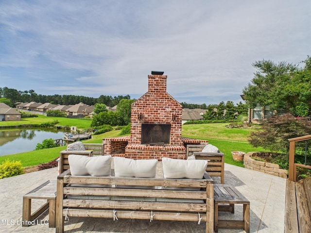 143 Charlton Dr, Madison, MS 39110 - view of patio with a water view and an outdoor living space with a fireplace