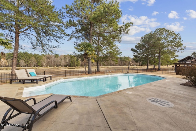 view of pool with a patio, fence, and a fenced in pool