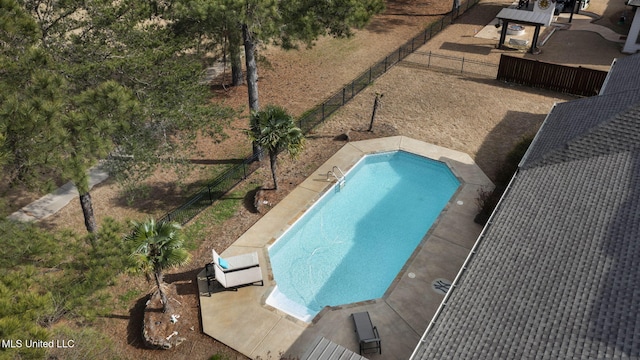 view of swimming pool featuring a fenced backyard and a fenced in pool