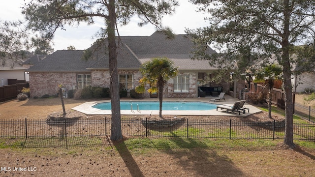 view of pool featuring a fenced backyard, a fenced in pool, and a patio