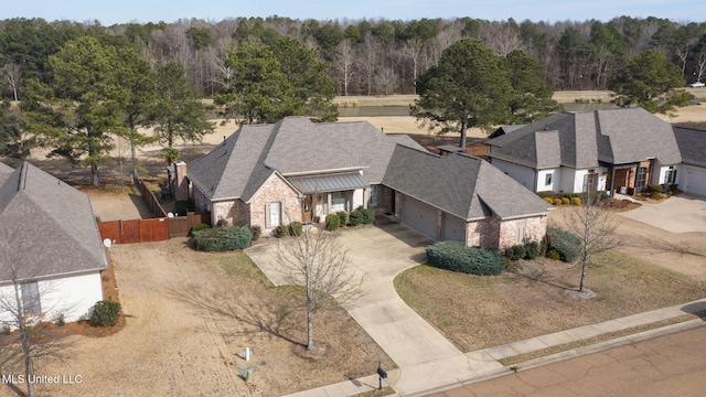 drone / aerial view featuring a view of trees