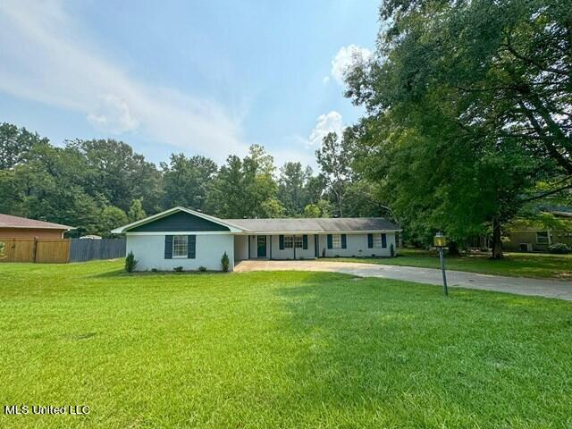 305 Longview St, Vicksburg, MS 39180 - single story home with concrete driveway, a front lawn, and fence