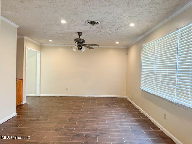305 Longview St, Vicksburg, MS 39180 - empty room featuring recessed lighting, crown molding, a ceiling fan, and baseboards