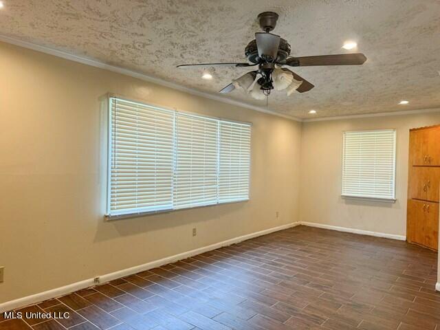 305 Longview St, Vicksburg, MS 39180 - spare room featuring baseboards, recessed lighting, ceiling fan, and crown molding
