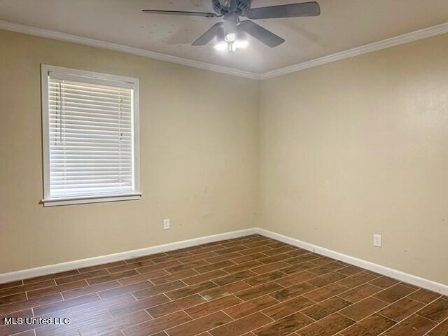 305 Longview St, Vicksburg, MS 39180 - spare room with ceiling fan, baseboards, ornamental molding, and wood tiled floor