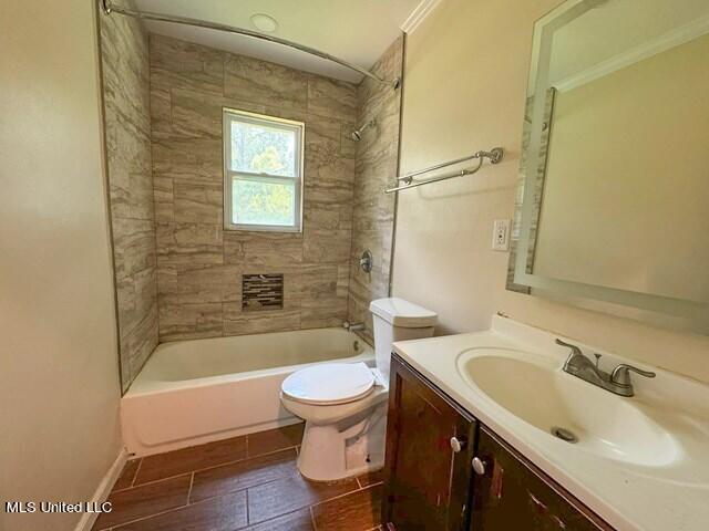 305 Longview St, Vicksburg, MS 39180 - bathroom with tile patterned floors, bathing tub / shower combination, toilet, vanity, and ornamental molding