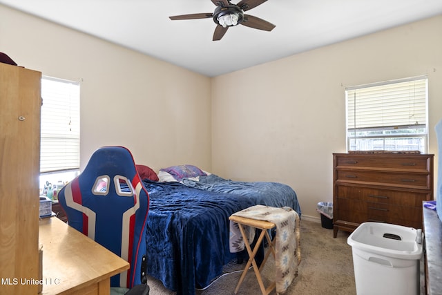 18496 Devin Ct, Gulfport, MS 39503 - carpeted bedroom with multiple windows and a ceiling fan
