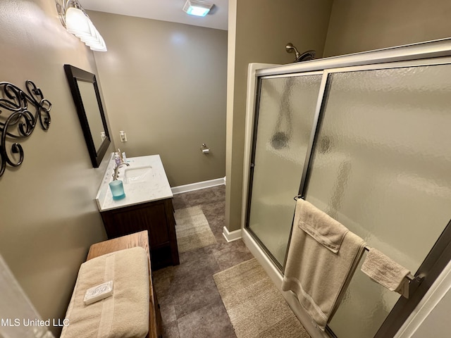 590 Eubanks Rd, Alligator, MS 38720 - bathroom featuring a stall shower, vanity, and baseboards