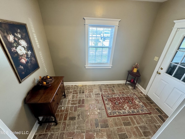 590 Eubanks Rd, Alligator, MS 38720 - doorway to outside with brick patterned floors and baseboards