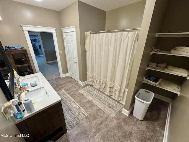 590 Eubanks Rd, Alligator, MS 38720 - full bath with a shower with shower curtain, double vanity, and baseboards