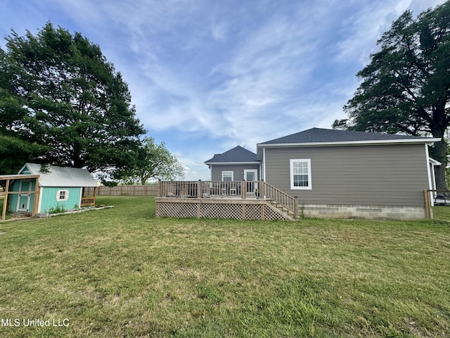 590 Eubanks Rd, Alligator, MS 38720 - rear view of house with a deck, a storage unit, and an outdoor structure