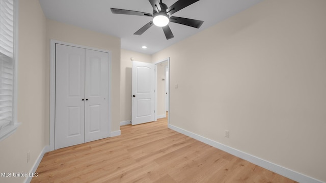 unfurnished bedroom featuring a closet, ceiling fan, and light hardwood / wood-style floors