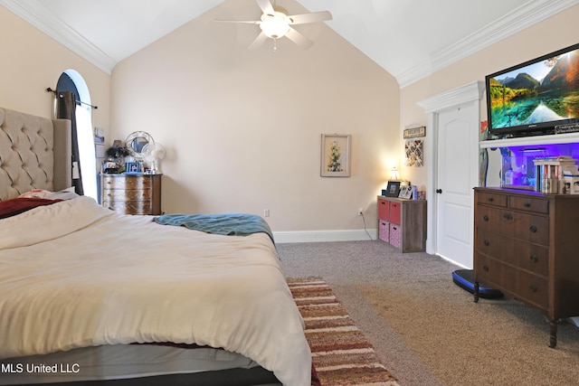 carpeted bedroom featuring vaulted ceiling, ornamental molding, and ceiling fan