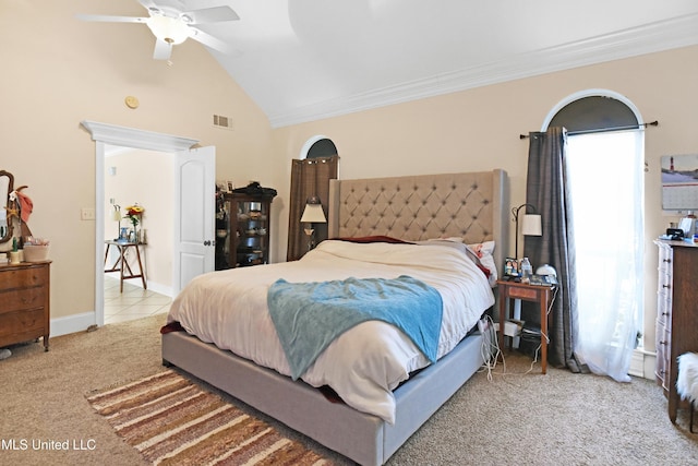 bedroom with light carpet, vaulted ceiling, ornamental molding, and ceiling fan