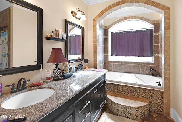 bathroom with vanity, a relaxing tiled tub, and crown molding