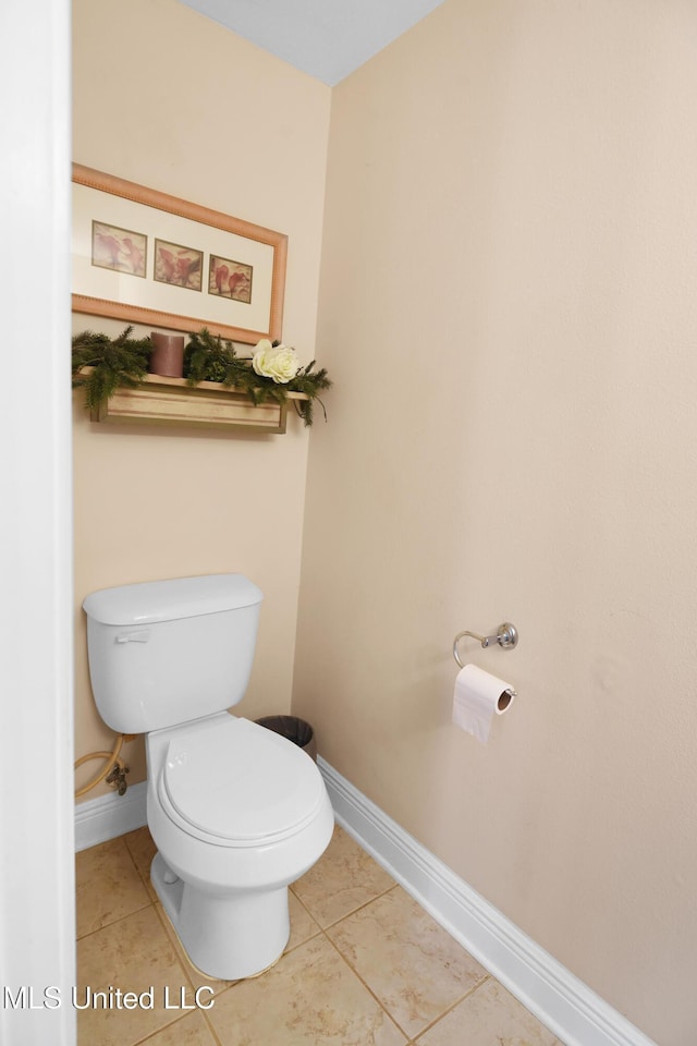 bathroom featuring tile patterned flooring and toilet