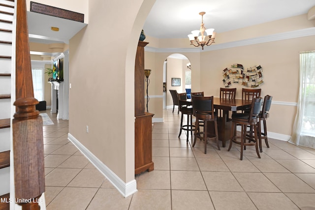 dining room featuring light tile patterned floors and an inviting chandelier