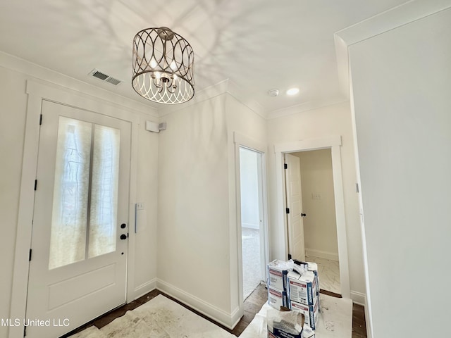 foyer entrance with an inviting chandelier