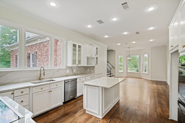1594 Victoria Rd, Byhalia, MS 38611 - kitchen featuring a sink, stainless steel dishwasher, white cabinets, light stone countertops, and ornamental molding
