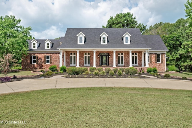 1594 Victoria Rd, Byhalia, MS 38611 - cape cod house featuring brick siding, a front lawn, and a porch