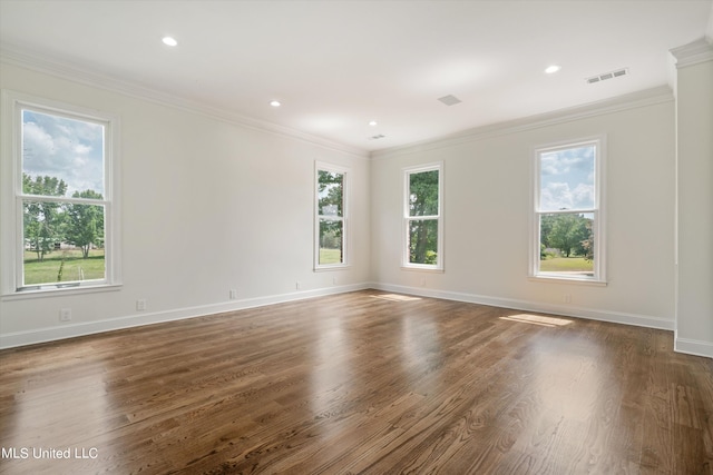 1594 Victoria Rd, Byhalia, MS 38611 - unfurnished room featuring plenty of natural light, wood finished floors, crown molding, baseboards, and recessed lighting