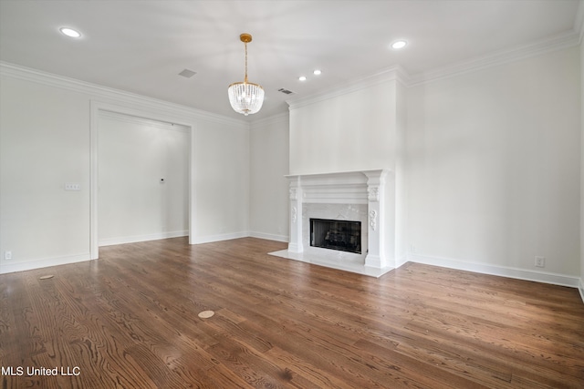 1594 Victoria Rd, Byhalia, MS 38611 - unfurnished living room with a high end fireplace, a chandelier, wood finished floors, ornamental molding, and recessed lighting