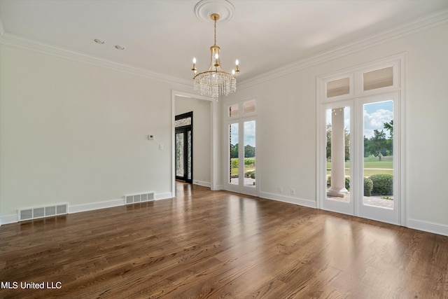 1594 Victoria Rd, Byhalia, MS 38611 - empty room featuring a chandelier, crown molding, wood finished floors, and baseboards