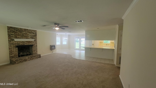 2257 Boyd Rd, Utica, MS 39175 - unfurnished living room featuring crown molding, light colored carpet, a fireplace, heating unit, and light tile patterned floors