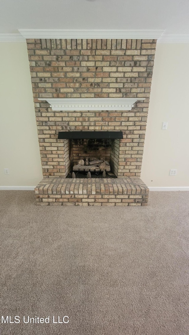 2257 Boyd Rd, Utica, MS 39175 - detailed view of ornamental molding, baseboards, a fireplace, and carpet floors