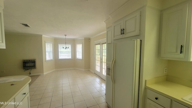 2257 Boyd Rd, Utica, MS 39175 - unfurnished dining area featuring heating unit, crown molding, baseboards, and light tile patterned flooring