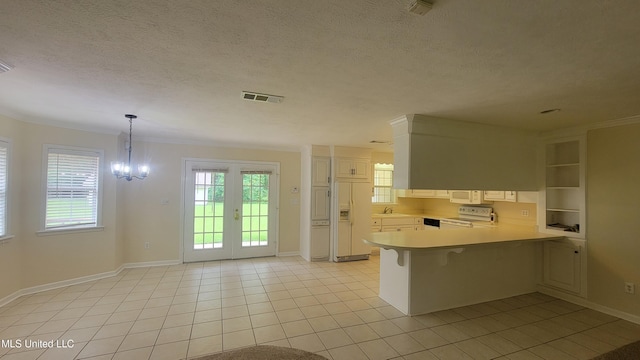 2257 Boyd Rd, Utica, MS 39175 - kitchen with white appliances, a peninsula, light countertops, a sink, and baseboards