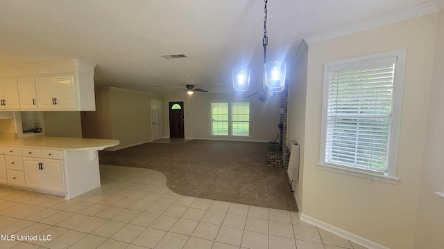 2257 Boyd Rd, Utica, MS 39175 - kitchen featuring crown molding, light colored carpet, light tile patterned flooring, baseboards, and white cabinetry