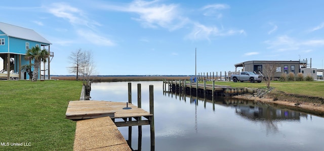 dock area featuring a water view and a yard