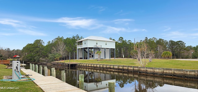 dock area featuring a water view and a yard