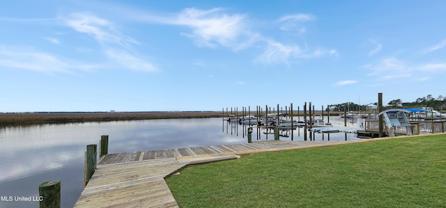 dock area featuring a water view and a lawn