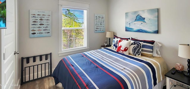 bedroom featuring wood finished floors